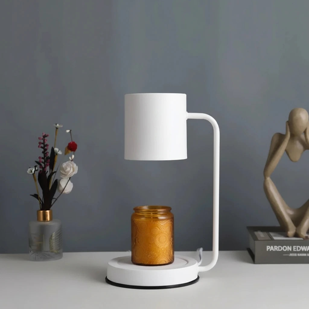 Aromatherapy wax melting lamp on a table with decorative items.
