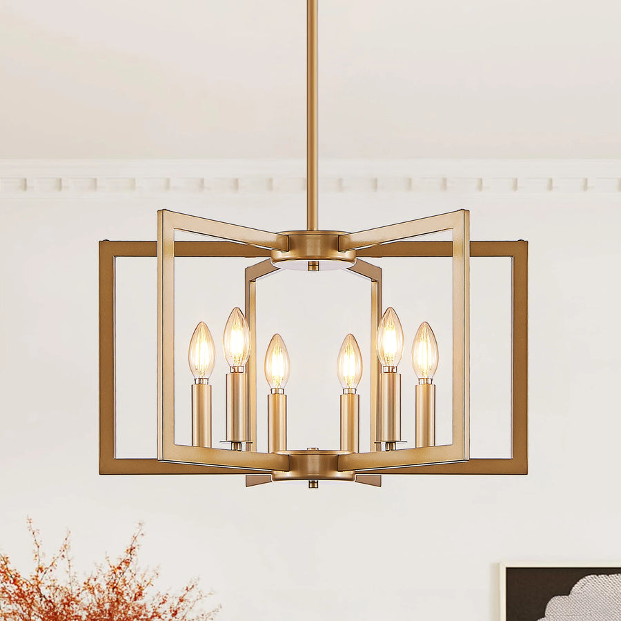 A modern six-light brass pendant chandelier with a geometric open-frame design and candle-style bulbs, shown hanging in a minimalist room setting.