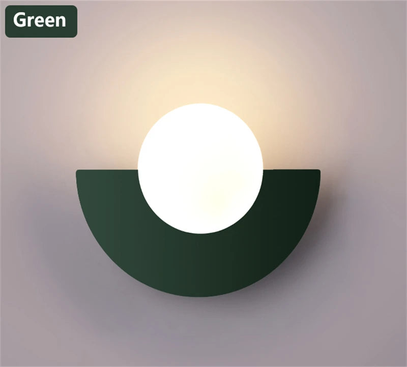 Wall-mounted light fixture with a green semi-circular base on a gray background