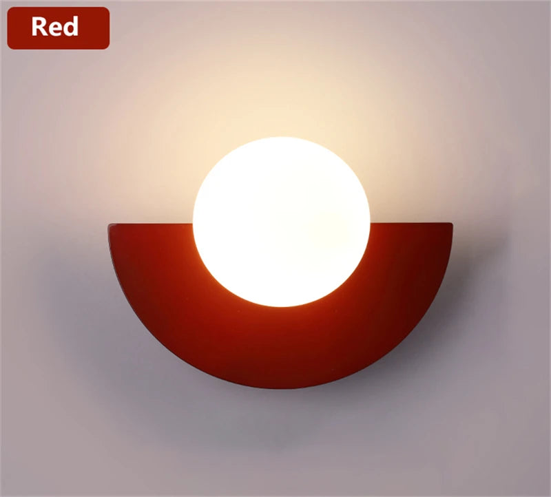Modern wall light fixture with a red base and white shade on a gray background