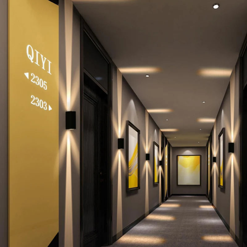 Modern hallway with gold doors and wall art