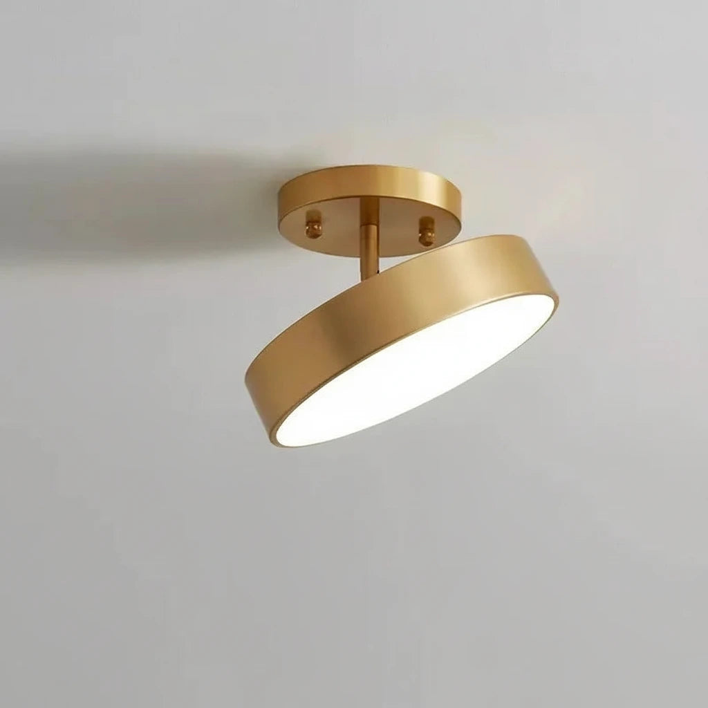 Gold ceiling light fixture on a gray background with branding.
