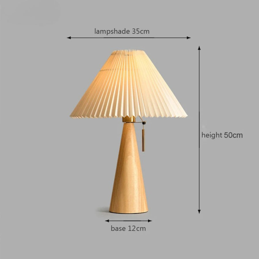 Wooden table lamp with pleated shade and dimensions on a gray background
